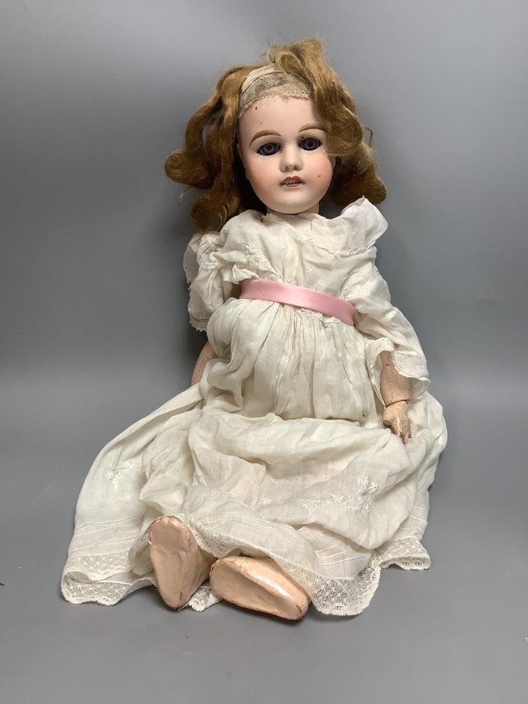 A French Mon Cheri doll, with jointed body, height 20 inches, 51cm